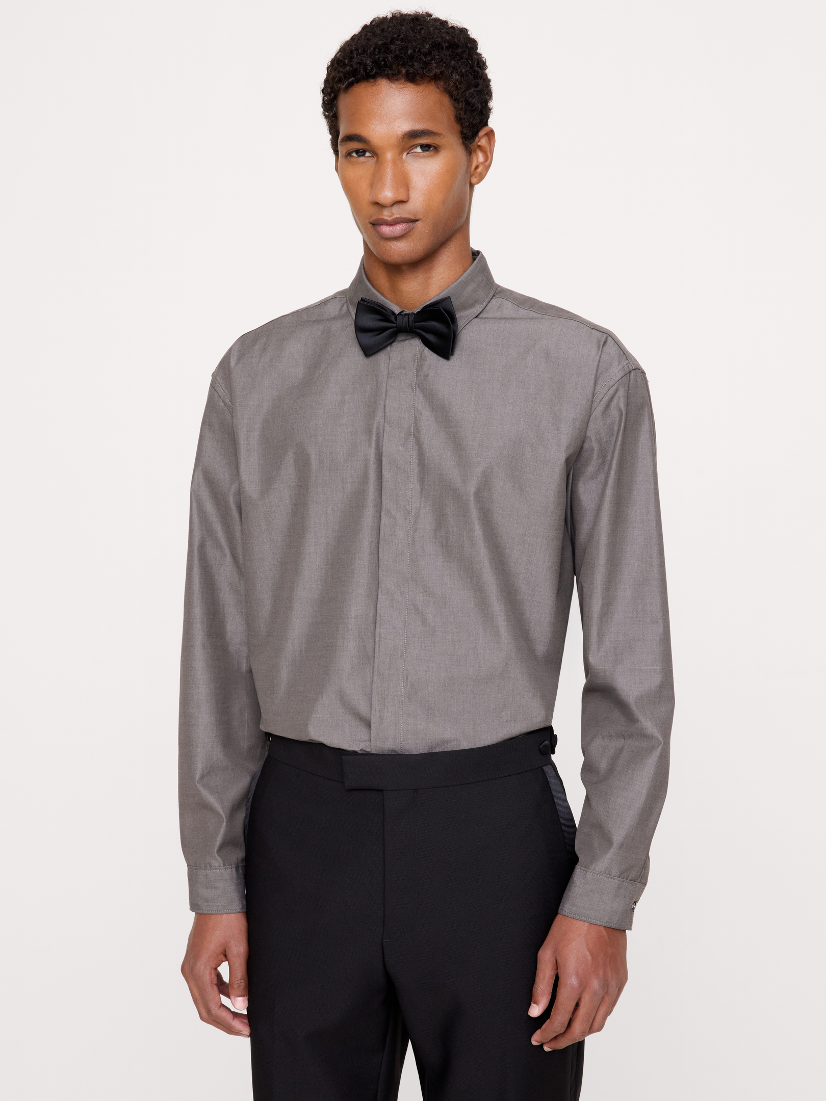 Image 1 of 4, A reflection of the past with details from today, this tuxedo dress shirt is made from incredibly soft poplin, set against a concealed placket for more streamlined style., Relaxed Fit: A straight & roomy fit with dropped shoulder seams., Point collar with concealed button closure., Shirttail hem., Product #1180027
