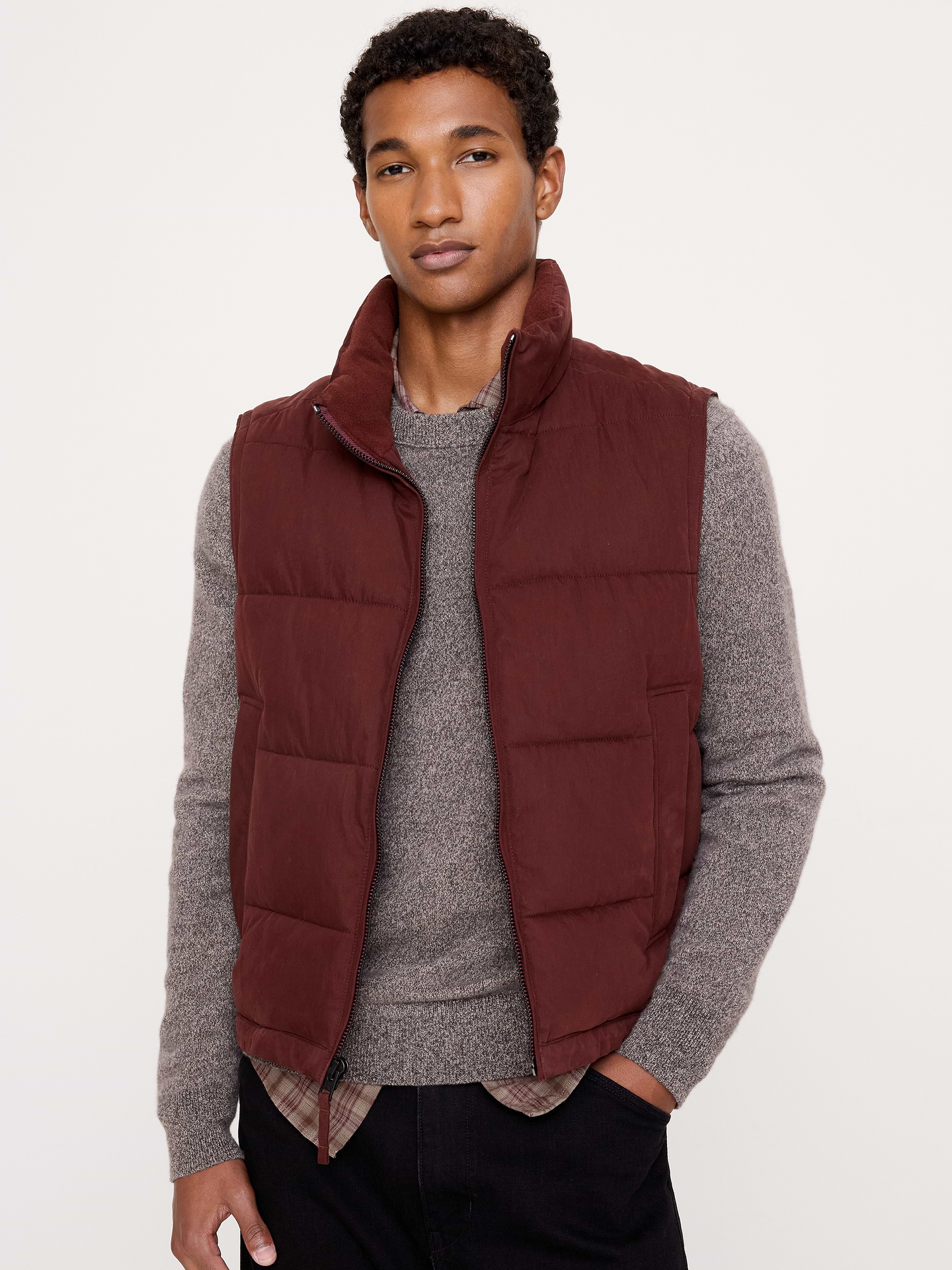 Image 1 of 8, This cozy puffer vest is made from a peachy-soft cotton blend with functional details, like a classic stand collar, bungee cord hem, and plenty of pocket space., Relaxed Fit: A straight & roomy fit with dropped shoulder seams., Stand collar with zip-front closure., Side pockets., Quilted., Product #915953