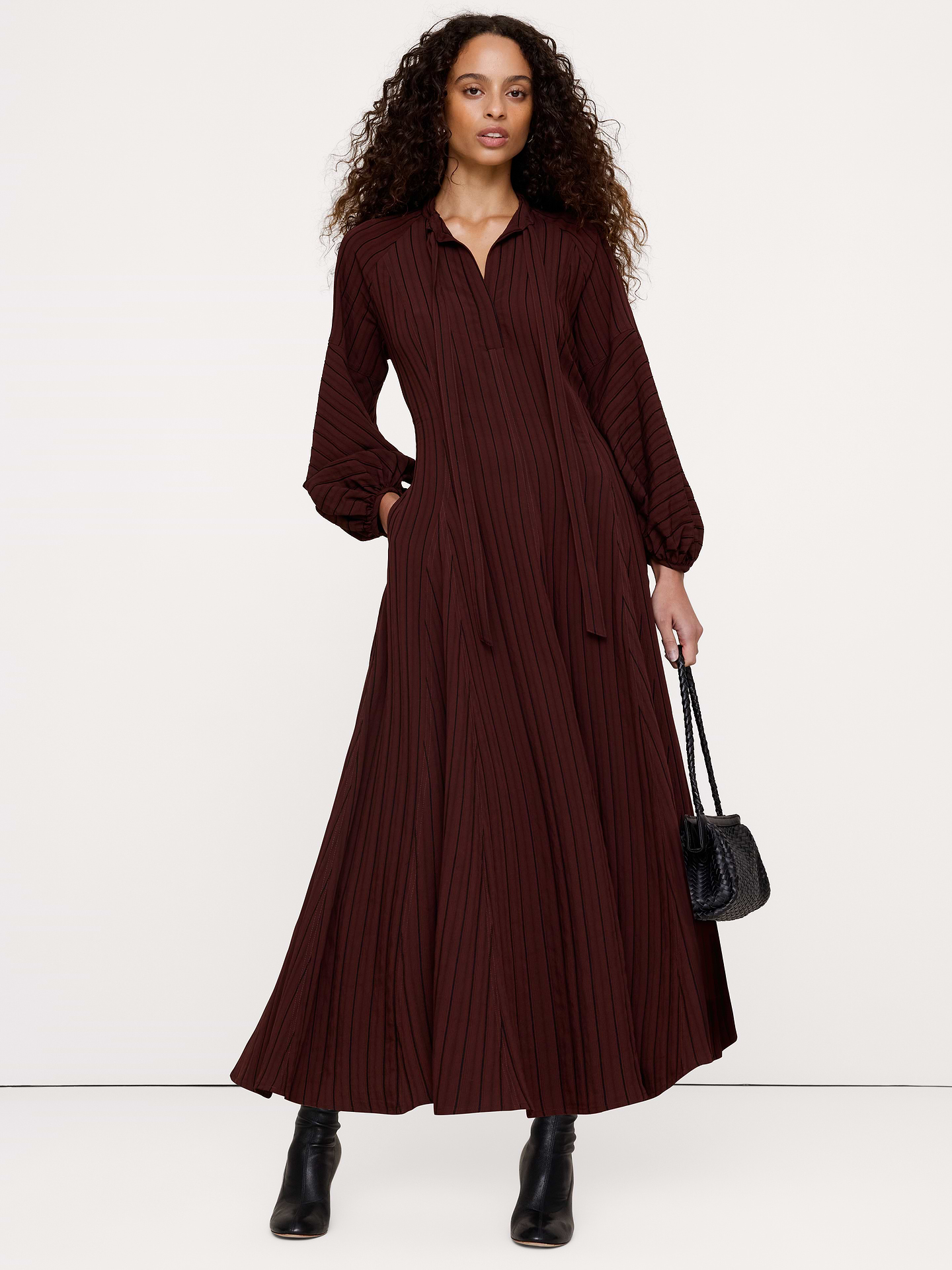 Image 1 of 6, Inspired by boho vibes, we crafted this soft and flowing maxi dress with a split neckline with optional tie, ruffles at the collar, and balloon sleeves., Trapeze Fit: An easy fit with an A-line silhouette., Split neck with button closures and ties., Unlined., Product #1182105