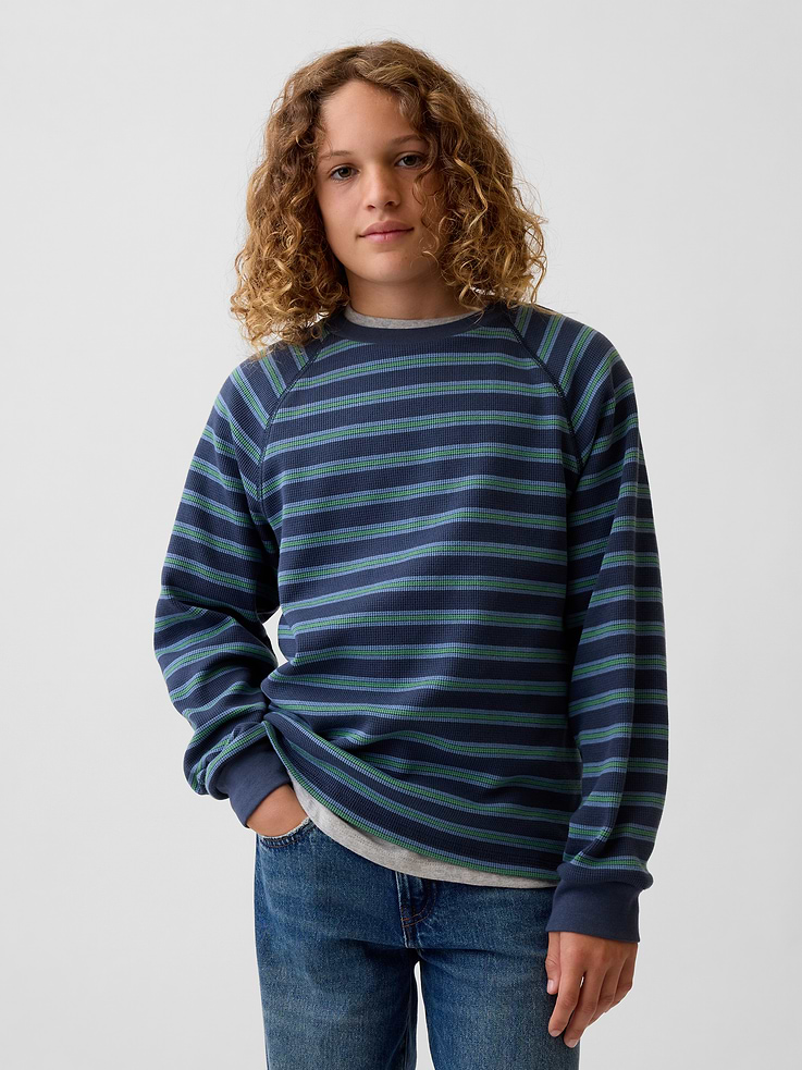 Image 1 of 5, Soft, stretch waffle-knit T-shirt. In relaxed and slim fits., Crewneck., Long sleeves., Graphics or print., This product was made in a factory that invests in gender equity and women’s empowerment through RISE. Learn more at gapinc.com/equity ., Product #1183770