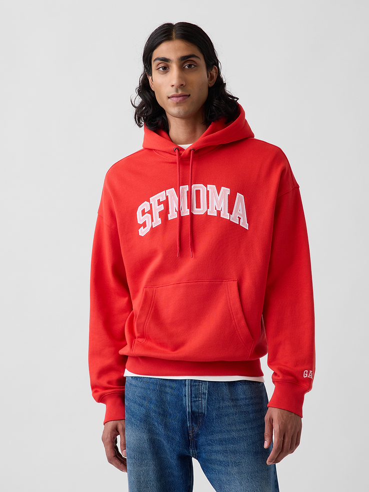 Image 1 of 9, Soft, heavyweight cotton-blend hoodie. In an oversized fit., Hooded neckline with drawcords., Long sleeves with mini embroidered Gap logo., SFMOMA arch logo at front., Kanga pocket., Banded hem and cuffs., Product #1191151
