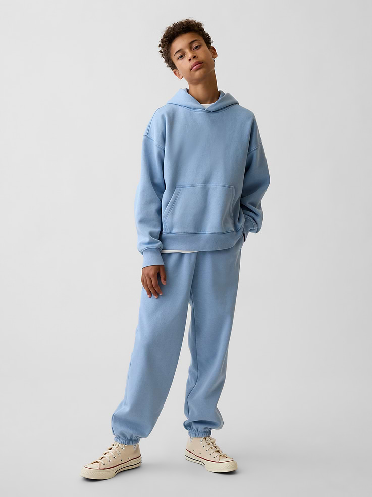 Image 1 of 5, Our softer than soft sweats. Brushed on the inside. Smooth on the outside. Made so that no two are alike., Soft cotton-blend fleece joggers. In a relaxed fit., Elasticized waist with inner drawcords., Side on-seam pockets, back patch pocket., Elasticized cuffs., Certain styles have the Gap logo at front., Made with 23% recycled polyester. Compared to virgin materials, using recycled materials helps reduce resource use and waste., Product #915489