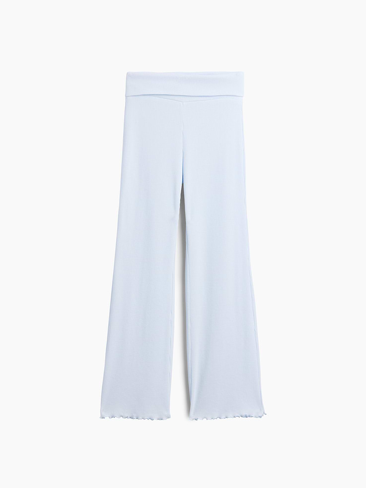 Image 1 of 3, Soft waffle knit flare leggings., Elasticized foldover waist., Lettuce edge hem., This product was made in a factory that invests in gender equity and women’s empowerment through RISE. Learn more at gapinc.com/equity ., Product #1184756