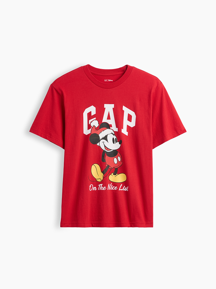Image 1 of 3, A very special collaboration between Gap and Disney— two timeless, iconic American brands— led us to create a collection that celebrates Mickey Mouse and Minnie Mouse., Soft cotton knit., Dropped shoulder, short sleeves., Crewneck., Gap logo with Mickey Mouse X-Mas graphic at front., Product #1185197