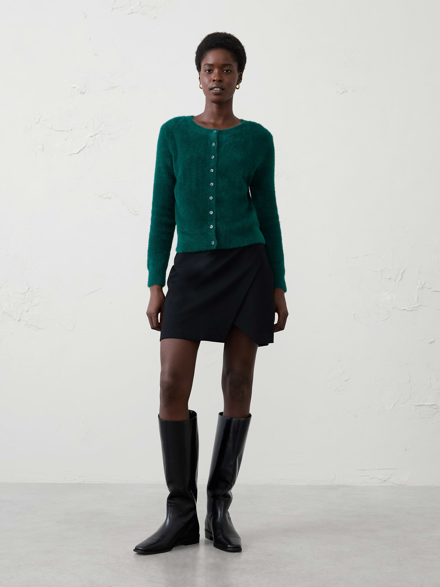 Image 1 of 4, Crafted from our signature eyelash yarn, this cardigan delivers an ultra‑soft, plush feel with a luxurious hand. The fuzzy texture adds rich dimension and cozy warmth, making it an effortless layering piece for cooler days., Crew neck. Long sleeves., Button‑front closure., Care suggestion: Use a low‑heat iron; steam as needed., Made exclusively for Banana Republic Factory., Product #1177061