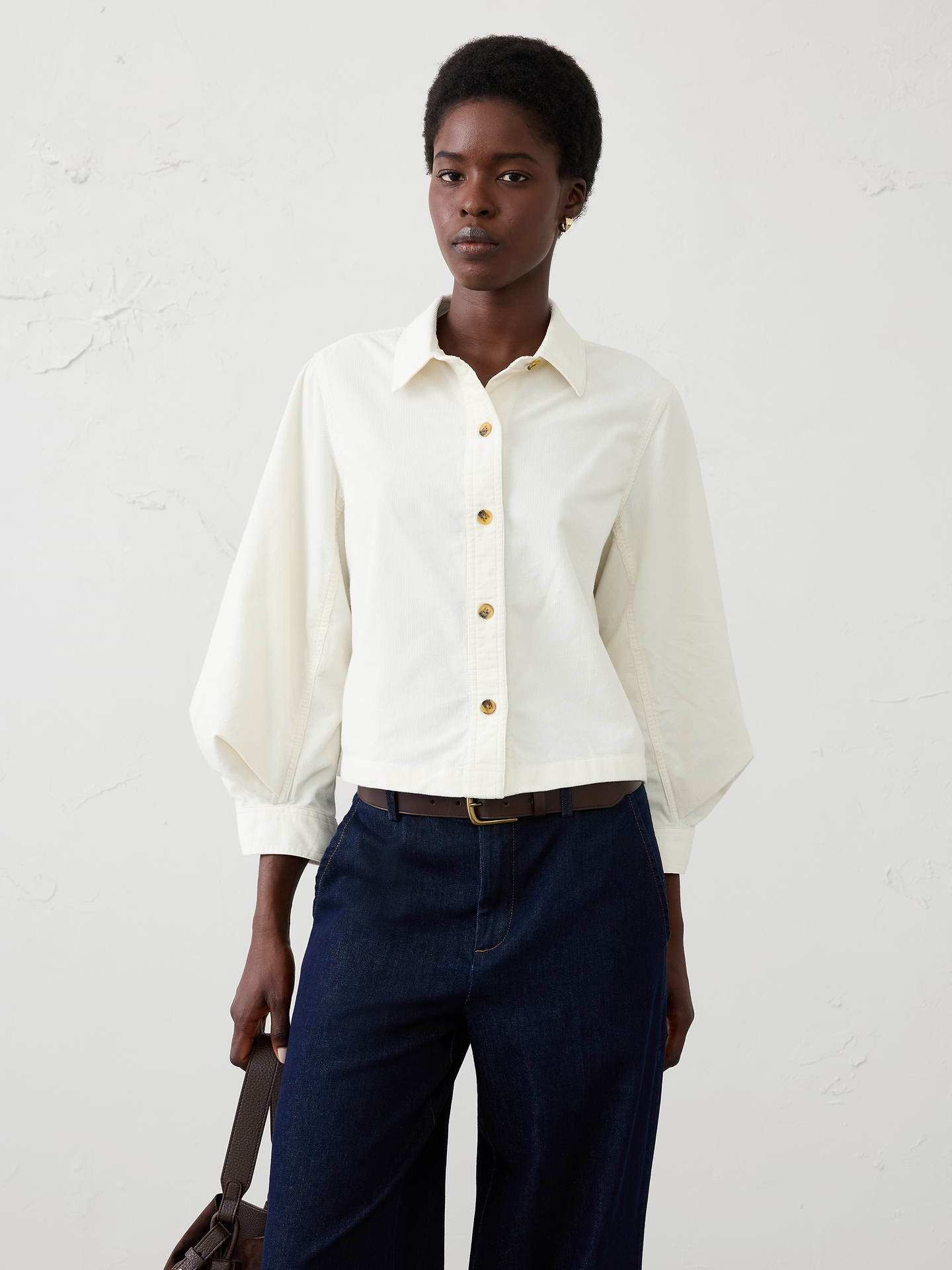 Image 1 of 4, Bring rich texture and effortless sophistication to your seasonal wardrobe with this corduroy blouson-sleeve shirt. Crafted from soft corduroy, this elevated casual style combines a classic button-front silhouette with voluminous blouson sleeves for a modern, feminine twist. Versatile and polished, it's an easy piece to wear from weekday outings to weekend gatherings., Point collar. Blouson long sleeves with button cuffs., Button-front closure., Center horizontal and vertical back seams., Made exclusively for Banana Republic Factory., Product #1185887