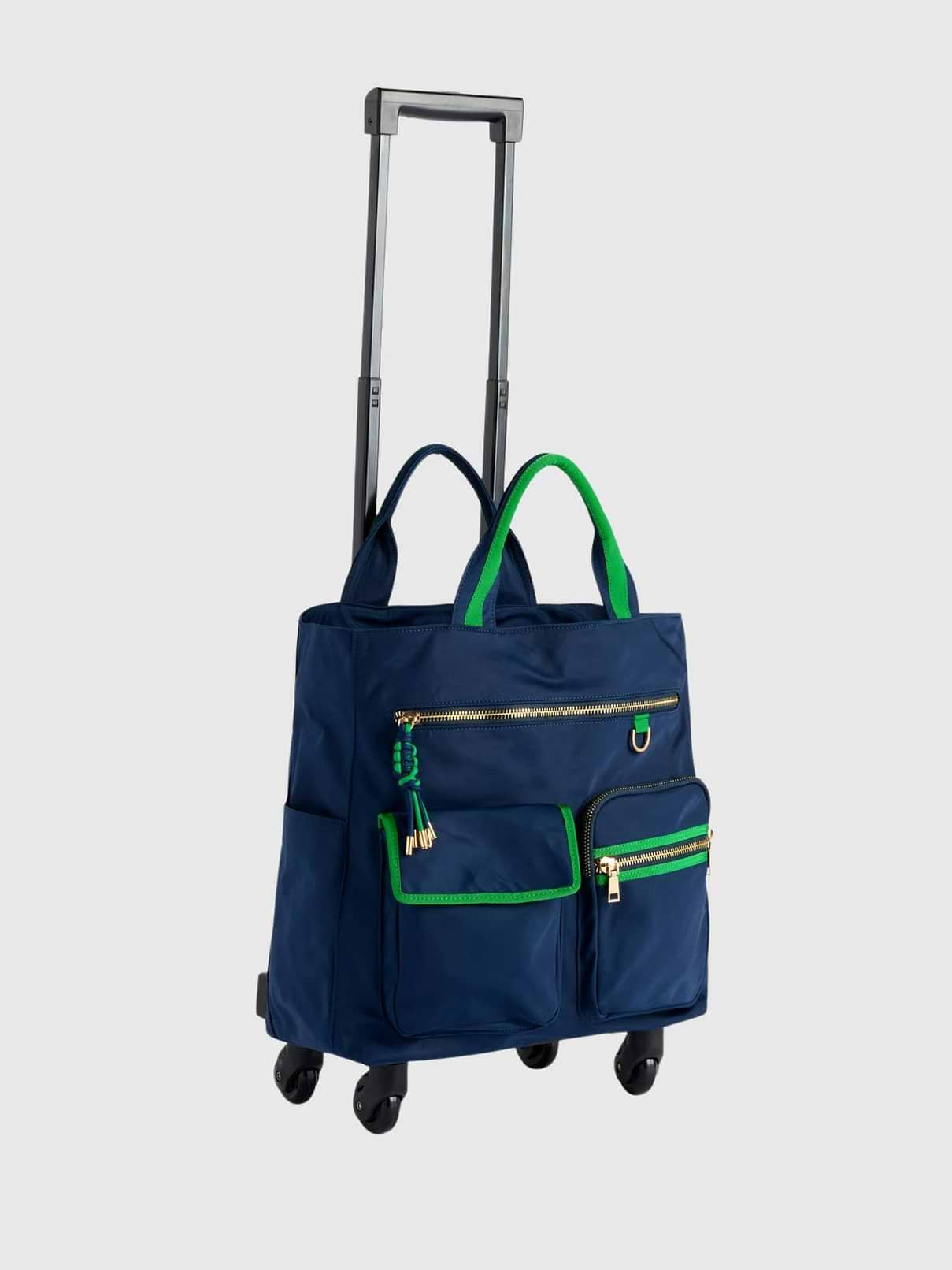 Image 1 of 1, The Jet 360° Roller Tote is ready to roll wherever your day takes you, combining chic style with travel-friendly function., Designed with smooth 360° spinner wheels, double handles, and an extending roller handle, this tote makes navigating airports, workdays, and weekend getaways feel effortless., Multiple exterior and interior pockets keep all your essentials neatly organized, while the top zip closure helps everything stay secure on the go., Finished with playful contrast trim, gold-tone hardware, and a stylish tassel zipper pull, the Jet 360° Roller Tote adds a fun pop of personality to every trip.