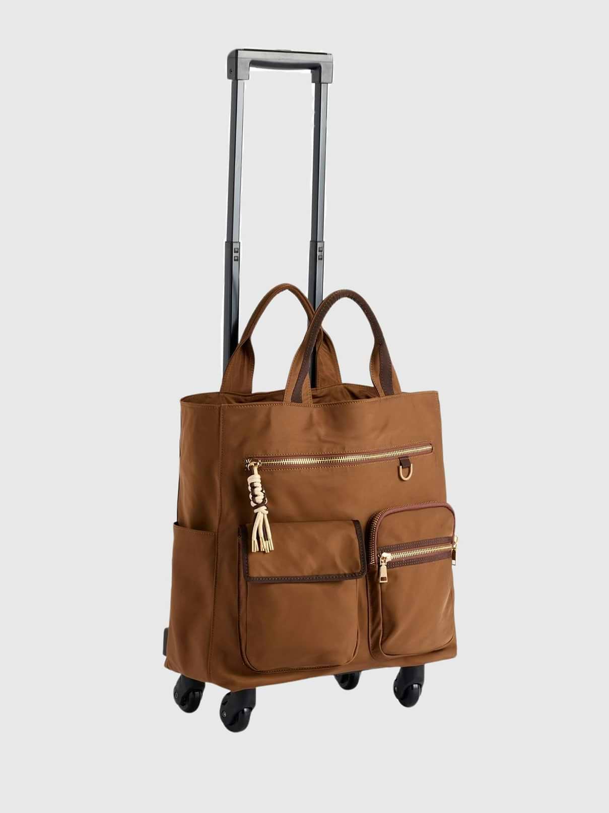 Image 1 of 2, The Jet 360° Roller Tote is ready to roll wherever your day takes you, combining chic style with travel-friendly function., Designed with smooth 360° spinner wheels, double handles, and an extending roller handle, this tote makes navigating airports, workdays, and weekend getaways feel effortless., Multiple exterior and interior pockets keep all your essentials neatly organized, while the top zip closure helps everything stay secure on the go., Finished with playful contrast trim, gold-tone hardware, and a stylish tassel zipper pull, the Jet 360° Roller Tote adds a fun pop of personality to every trip.