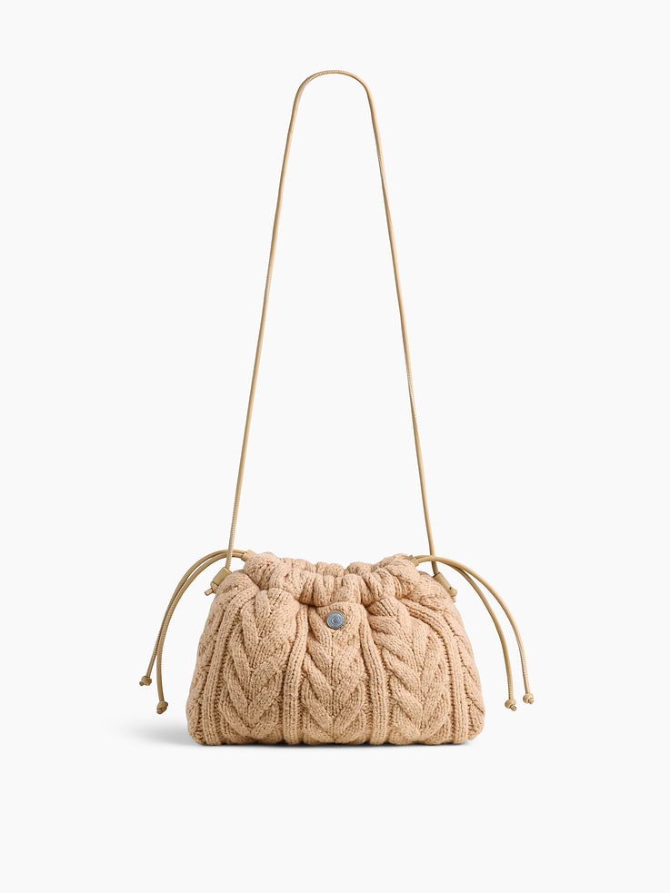 Image 1 of 6, Supersoft cable-knit pouchette., Worn hand-held, crossbody or over-the-shoulder., Shoulder strap., Drawcord closure at top., Product #1186129