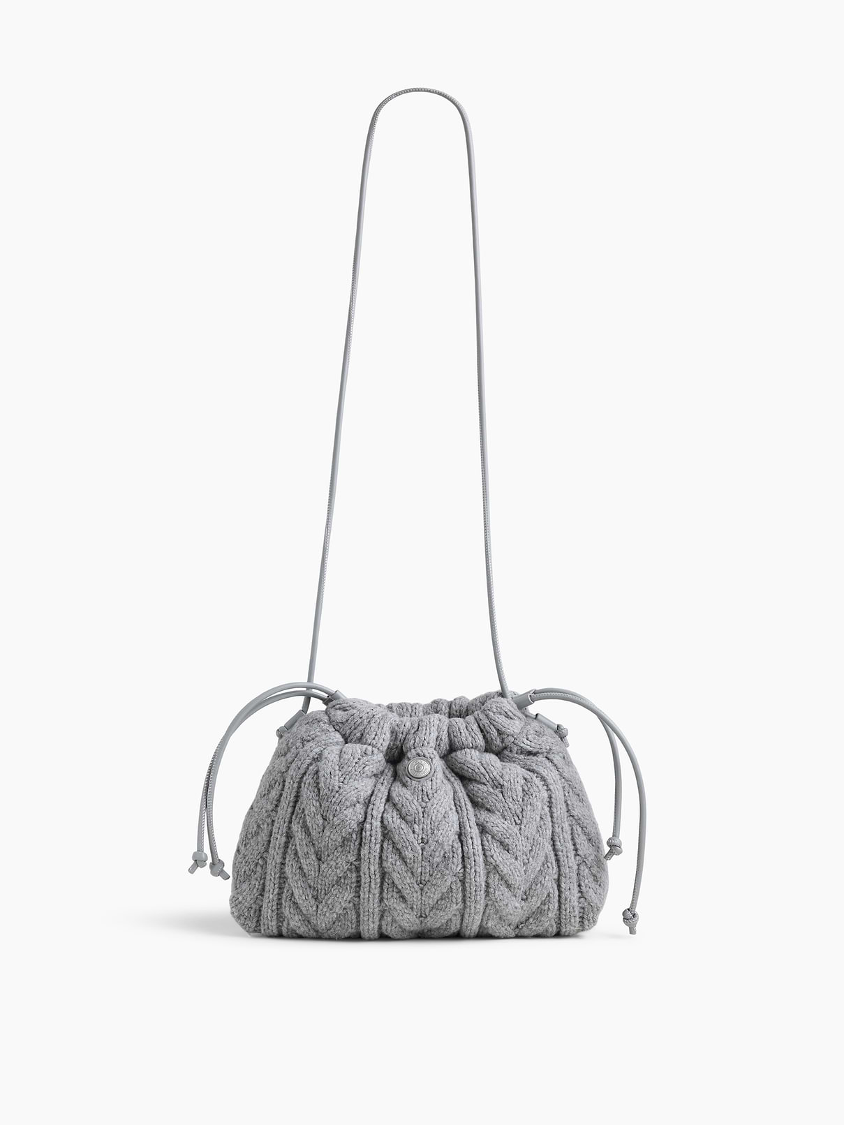 Image 1 of 6, Supersoft cable-knit pouchette., Worn hand-held, crossbody or over-the-shoulder., Shoulder strap., Drawcord closure at top., Product #1186129