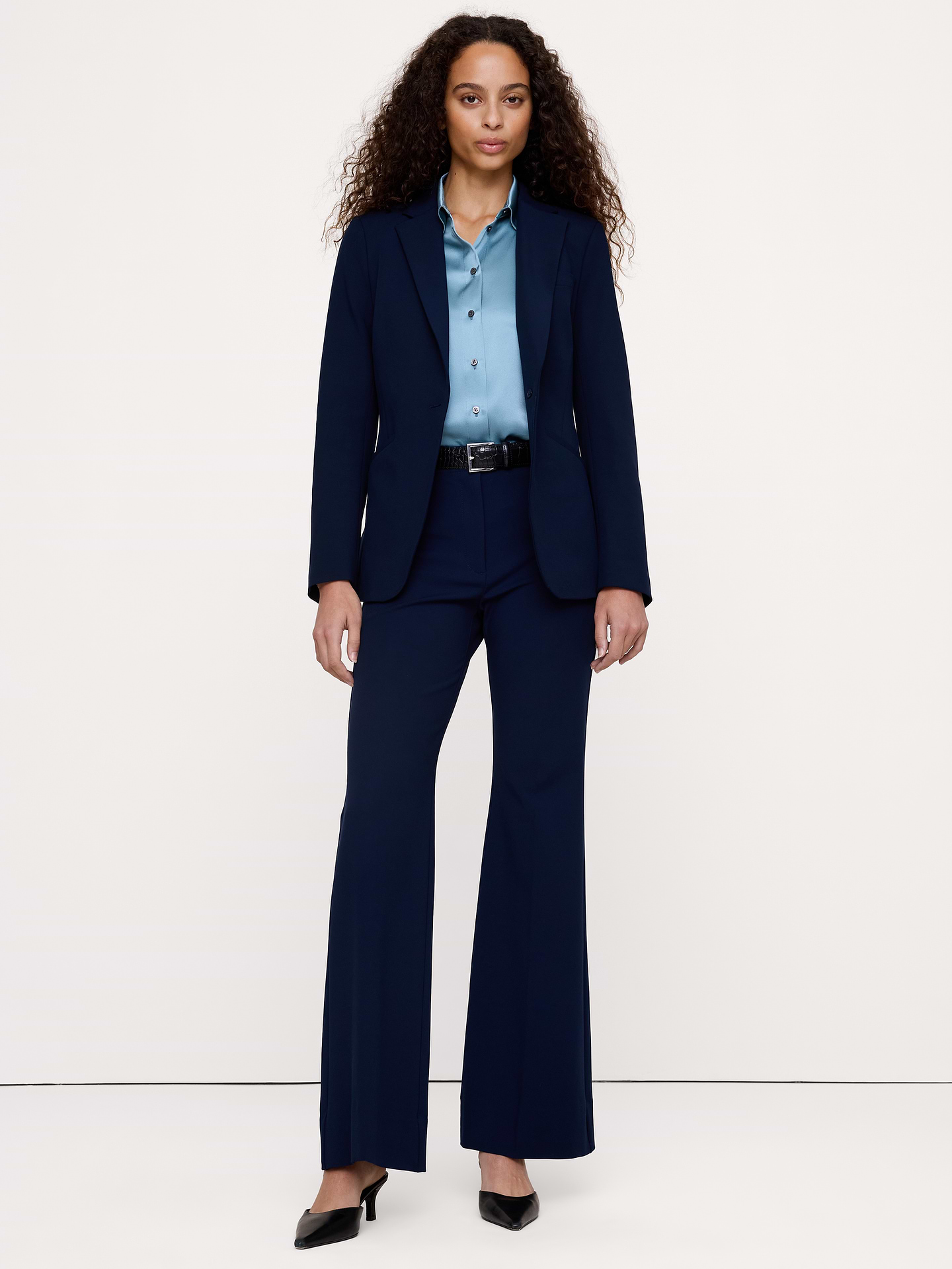 Image 1 of 8, We love when a pant that looks as good as it feels, so we cut this flared pant in our City Stretch fabric—beloved for its softness, high-stretch and dressed-up appearance., High-Rise Flare: High-waisted, Fitted through waist, hip, and thigh with a flared leg. Full length., Zip fly with hook-and-bar closure. Belt loops., Trouser crease., Unlined., Product #853869