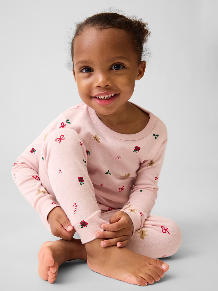 Image 1 of 4, Our comfiest PJs—now softer than ever. Cozy brushed cotton on the inside. All their favorite prints & colors on the outside., Soft cotton pajama top and pants PJ set with a cozy brushed interior., Crewneck., Long sleeves., Elasticized waist at PJ pants., Banded cuffs., Allover print., Made with 100% organically grown cotton, which is grown without the use of synthetic pesticides and fertilizers., Note: Sizing for select prints extends up to 12 YRS for certain styles., Shop matching PJs for all., This product was made in a factory that invests in gender equity and women’s empowerment through RISE. Learn more at gapinc.com/equity ., Product #915908