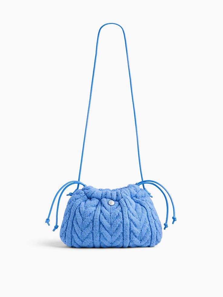 Image 1 of 6, Supersoft cable-knit pouchette., Worn hand-held, crossbody or over-the-shoulder., Shoulder strap., Drawcord closure at top., Product #1186129