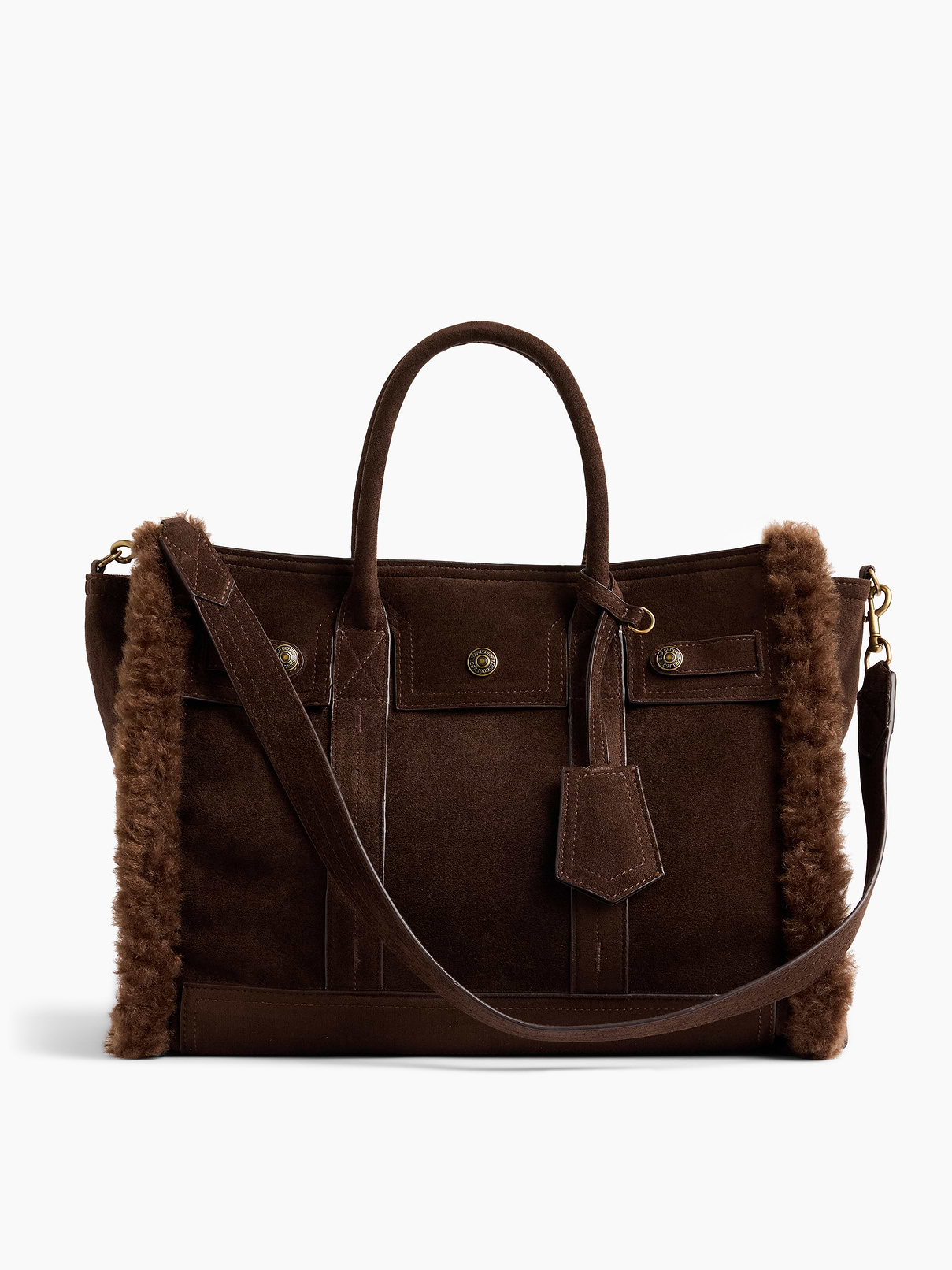 Image 1 of 7, Soft vegan suede tote bag with a cozy sherpa lining., Worn at the elbow, over the shoulder, or handheld., Double handles and removable shoulder strap., Bridge snap closure at top., Button-snap pocket at front., Two outer side slip pockets., Key-holder tag at handle., Two interior slip pockets., Laptop friendly: up to 13"., Note: The dye used in the crafting of this product is prone to crocking, or color transfer. Please avoid contact with light-colored fabric or upholstery., Product #1189400