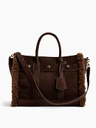Image 1 of 7, Soft vegan suede tote bag with a cozy sherpa lining., Worn at the elbow, over the shoulder, or handheld., Double handles and removable shoulder strap., Bridge snap closure at top., Button-snap pocket at front., Two outer side slip pockets., Key-holder tag at handle., Two interior slip pockets., Laptop friendly: up to 13"., Note: The dye used in the crafting of this product is prone to crocking, or color transfer. Please avoid contact with light-colored fabric or upholstery., Product #1189400