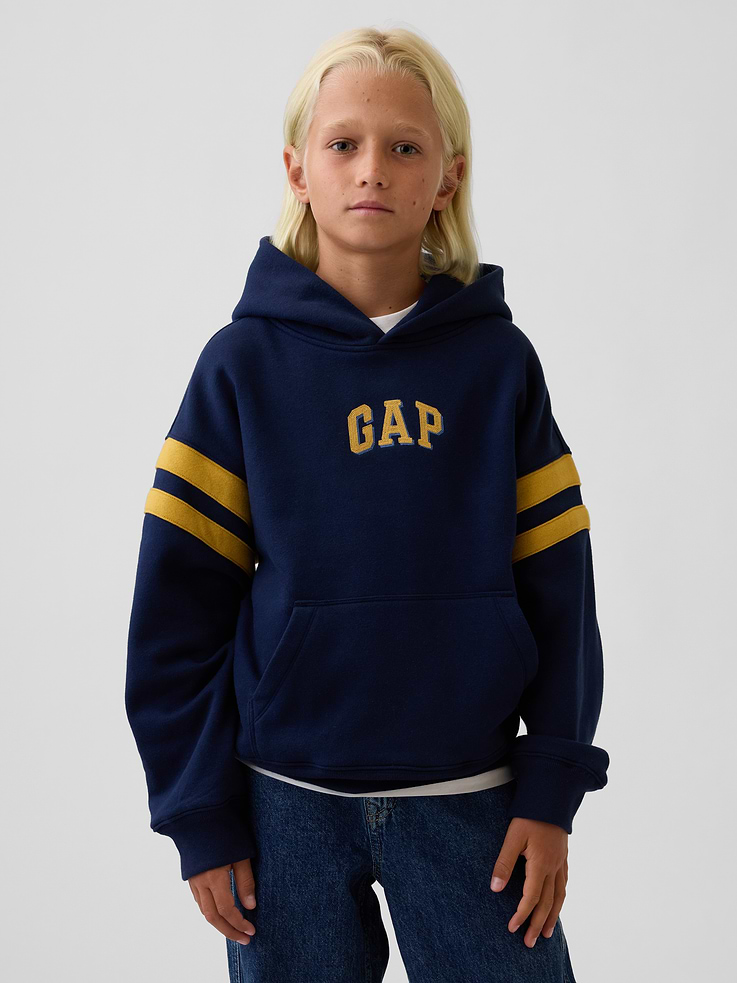 Image 1 of 5, Our softer than soft sweats. Brushed on the inside. Smooth on the outside. Made so that no two are alike., Soft cotton-blend fleece pullover hoodie. In a relaxed fit., Hooded neckline., Long sleeves with drop shoulders., Gap arch logo at front., Kanga pocket., Banded rib cuffs and hem., Made with 52% Protocol cotton verified by the U.S. Cotton Trust Protocol, a program which works with farms committed to improving their environmental footprint by minimizing water usage and improving soil health (Claim No. 10127)., Made with 23% recycled polyester. Compared to virgin materials, using recycled materials helps reduce resource use and waste., This product was made in a factory that invests in gender equity and women’s empowerment through RISE. Learn more at gapinc.com/equity ., Product #1184268