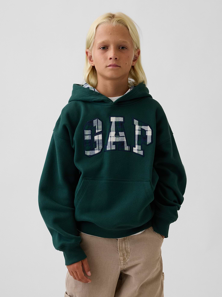 Image 1 of 6, Our softer than soft sweats. Brushed on the inside. Smooth on the outside. Made so that no two are alike., Soft cotton-blend fleece pullover hoodie. In a relaxed fit., Hooded neckline., Long sleeves with drop shoulders., Gap arch logo at front., Kanga pocket., Banded rib cuffs and hem., Made with 52% Protocol cotton verified by the U.S. Cotton Trust Protocol, a program which works with farms committed to improving their environmental footprint by minimizing water usage and improving soil health (Claim No. 10127)., Made with 23% recycled polyester. Compared to virgin materials, using recycled materials helps reduce resource use and waste., Explore the Gap Gift Shop ., This product was made in a factory that invests in gender equity and women’s empowerment through RISE. Learn more at gapinc.com/equity ., Product #1184268
