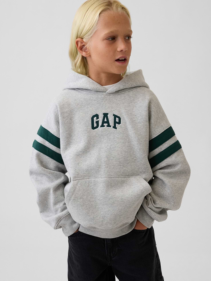 Image 1 of 6, Our softer than soft sweats. Brushed on the inside. Smooth on the outside. Made so that no two are alike., Soft cotton-blend fleece pullover hoodie. In a relaxed fit., Hooded neckline., Long sleeves with drop shoulders., Gap arch logo at front., Kanga pocket., Banded rib cuffs and hem., Made with 52% Protocol cotton verified by the U.S. Cotton Trust Protocol, a program which works with farms committed to improving their environmental footprint by minimizing water usage and improving soil health (Claim No. 10127)., Made with 23% recycled polyester. Compared to virgin materials, using recycled materials helps reduce resource use and waste., This product was made in a factory that invests in gender equity and women’s empowerment through RISE. Learn more at gapinc.com/equity ., Product #1184268