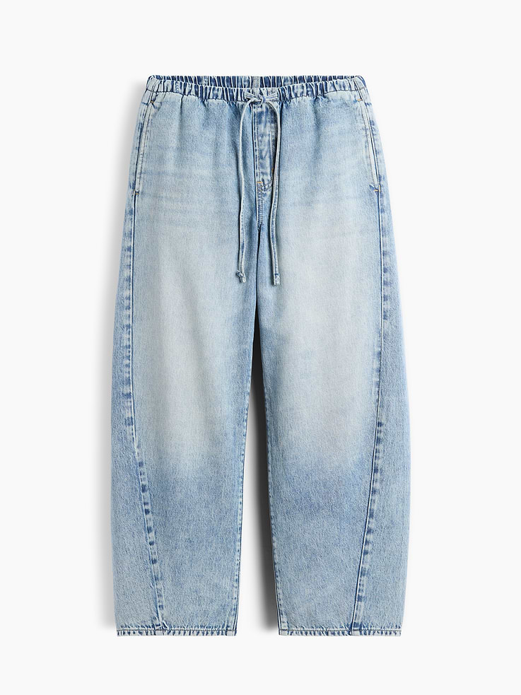 Image 1 of 2, The softest denim ever made. Our exclusive, ultra-light Tencel™ blend with an easy drape for year-round wears., Fit: A full-length barrel jean that's fitted at the waist with a relaxed leg and tapered ankle., Fabric: 60% Cotton, 40% Lyocell Lenzing TENCEL., Stretch: No Stretch Jeans. Authentic denim that gets better with every wear. Made to wear all day & break in over time., Rise: Mid Rise Jeans., Look: An easy barrel jean in a light indigo wash., Details: Drawcords at elasticized waist & four-pocket styling., Responsibly Made: This pair of jeans is part of our water-saving Washwell program. Compared with conventional wash methods, Washwell uses at least 20% less water., Explore our GapJeans Guide ., Product #1190728