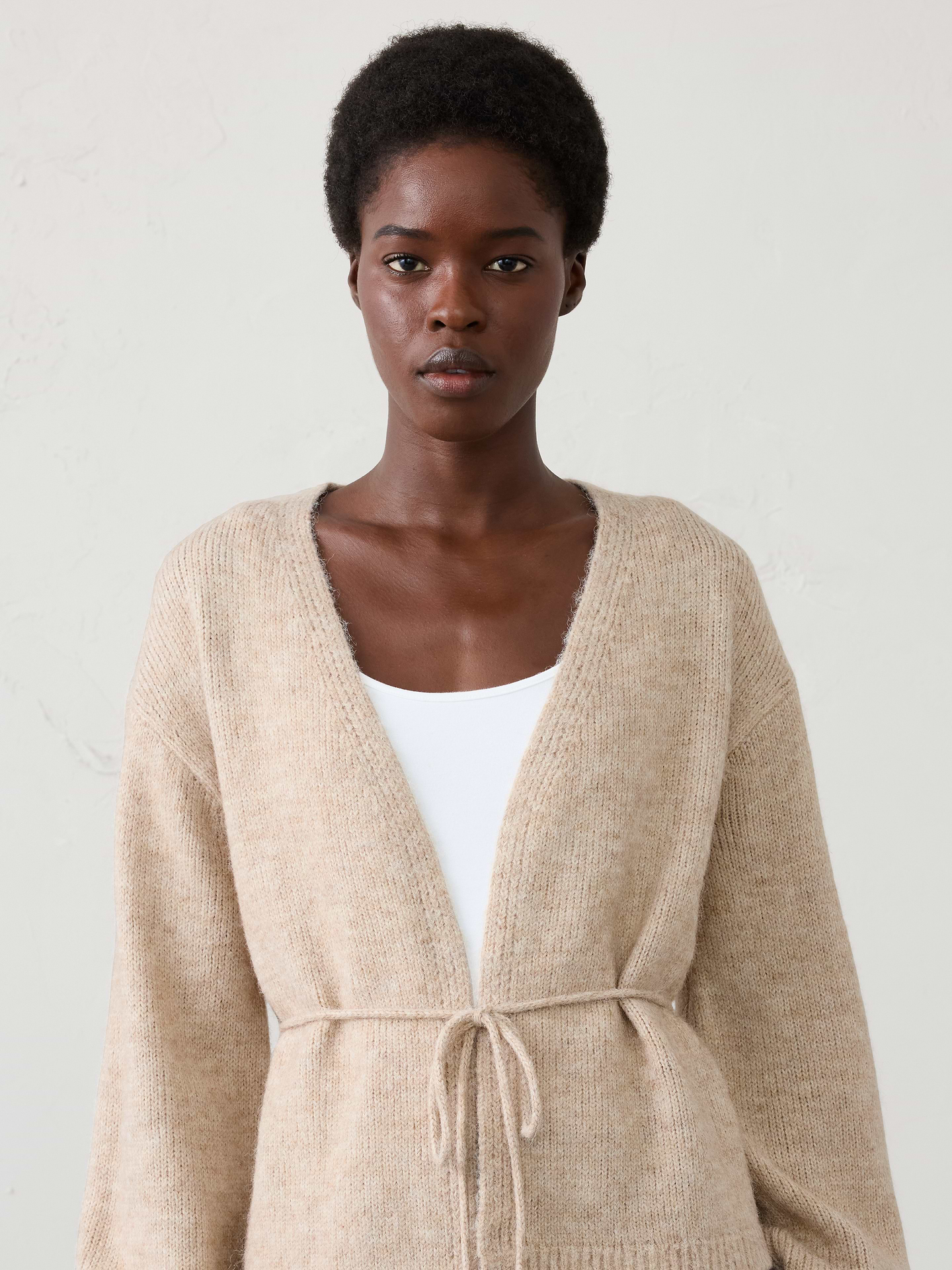 Image 1 of 4, Wrap yourself in plush comfort with this open-front cardigan, crafted from a brushed yarn that feels exceptionally soft and cozy against the skin. The fuzzy texture creates a rich, dimensional look while remaining lightweight enough for effortless layering., Open-front silhouette with self-tie belt at waist. Long sleeves., Ribbed arm cuffs and hem., Made exclusively for Banana Republic Factory., Product #1178532