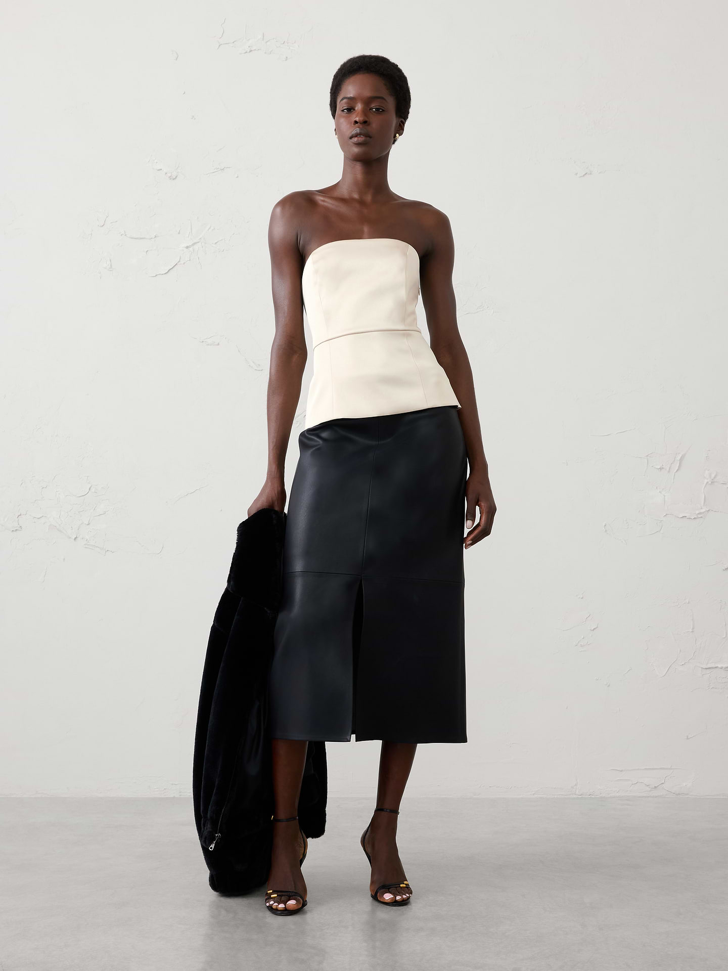 Image 1 of 4, A customer‑favorite silhouette returns. Designed with a sleek, structured fit and lustrous satin finish, this bustier brings a modern, elevated touch to occasion dressing., SUSTAINABILITY: Made with 81% recycled polyester., Straight neckline. Sleeveless., Grip tape along neckline., Invisible side zipper at wearer's left., Seamed waist., Back vented hem opens from the waist., Fully lined., Made exclusively for Banana Republic Factory., Product #1185886