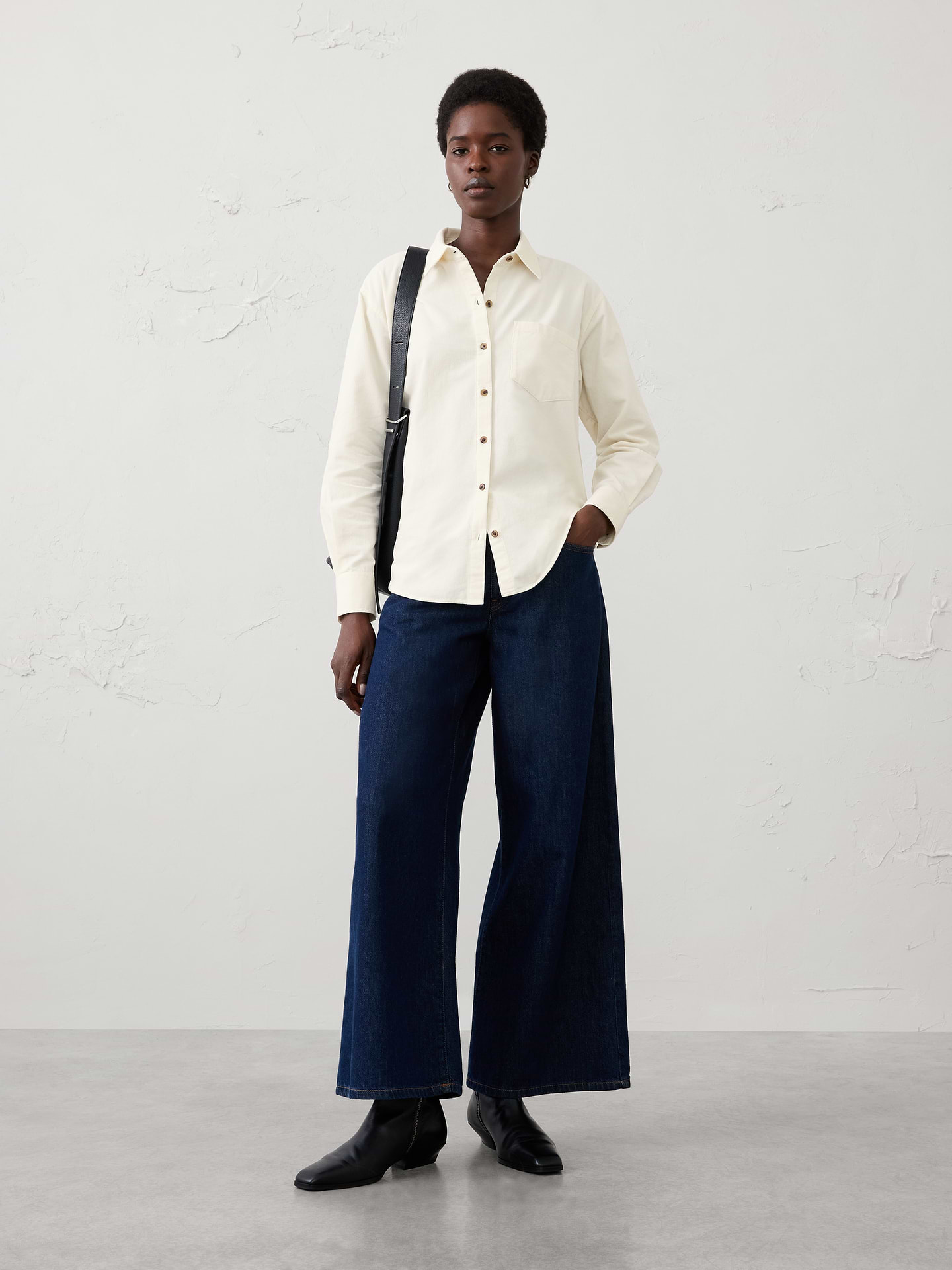 Image 1 of 4, Stand collar. Long sleeves with buttoned cuffs., Button‑front closure., Chest pocket., Back yoke with box pleat., High-low shirttail hem., 1185917, Made exclusively for Banana Republic Factory., Product #1185917