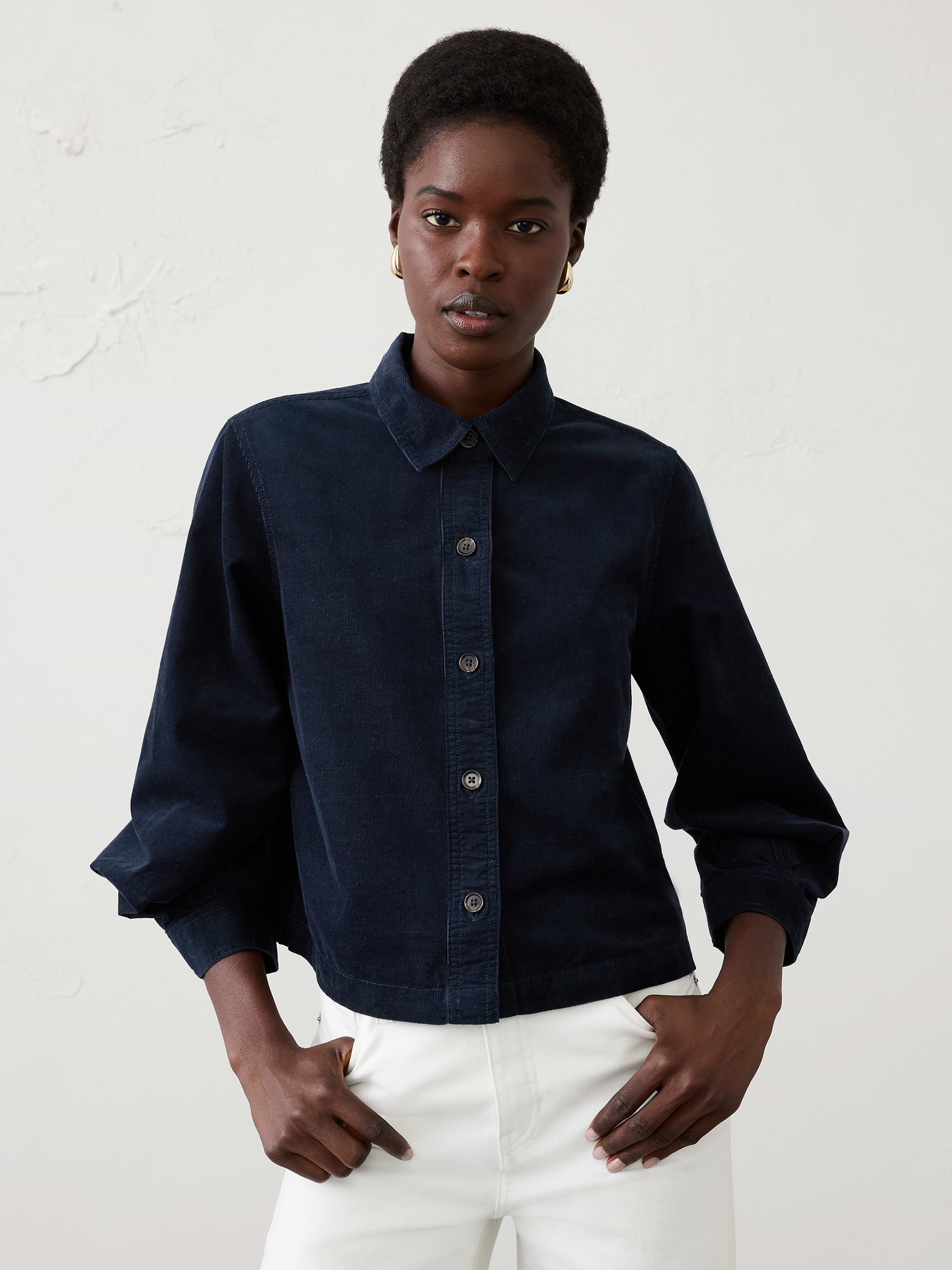Image 1 of 4, Bring rich texture and effortless sophistication to your seasonal wardrobe with this corduroy blouson-sleeve shirt. Crafted from soft corduroy, this elevated casual style combines a classic button-front silhouette with voluminous blouson sleeves for a modern, feminine twist. Versatile and polished, it's an easy piece to wear from weekday outings to weekend gatherings., Point collar. Blouson long sleeves with button cuffs., Button-front closure., Center horizontal and vertical back seams., Made exclusively for Banana Republic Factory., Product #1185887
