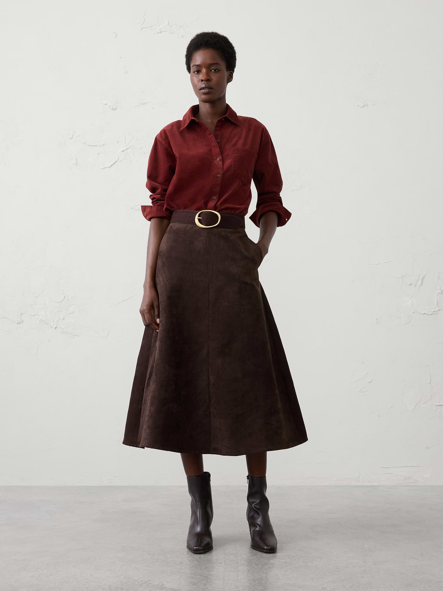Image 1 of 4, Stand collar. Long sleeves with buttoned cuffs., Button‑front closure., Chest pocket., Back yoke with box pleat., High-low shirttail hem., 1185917, Made exclusively for Banana Republic Factory., Product #1185917