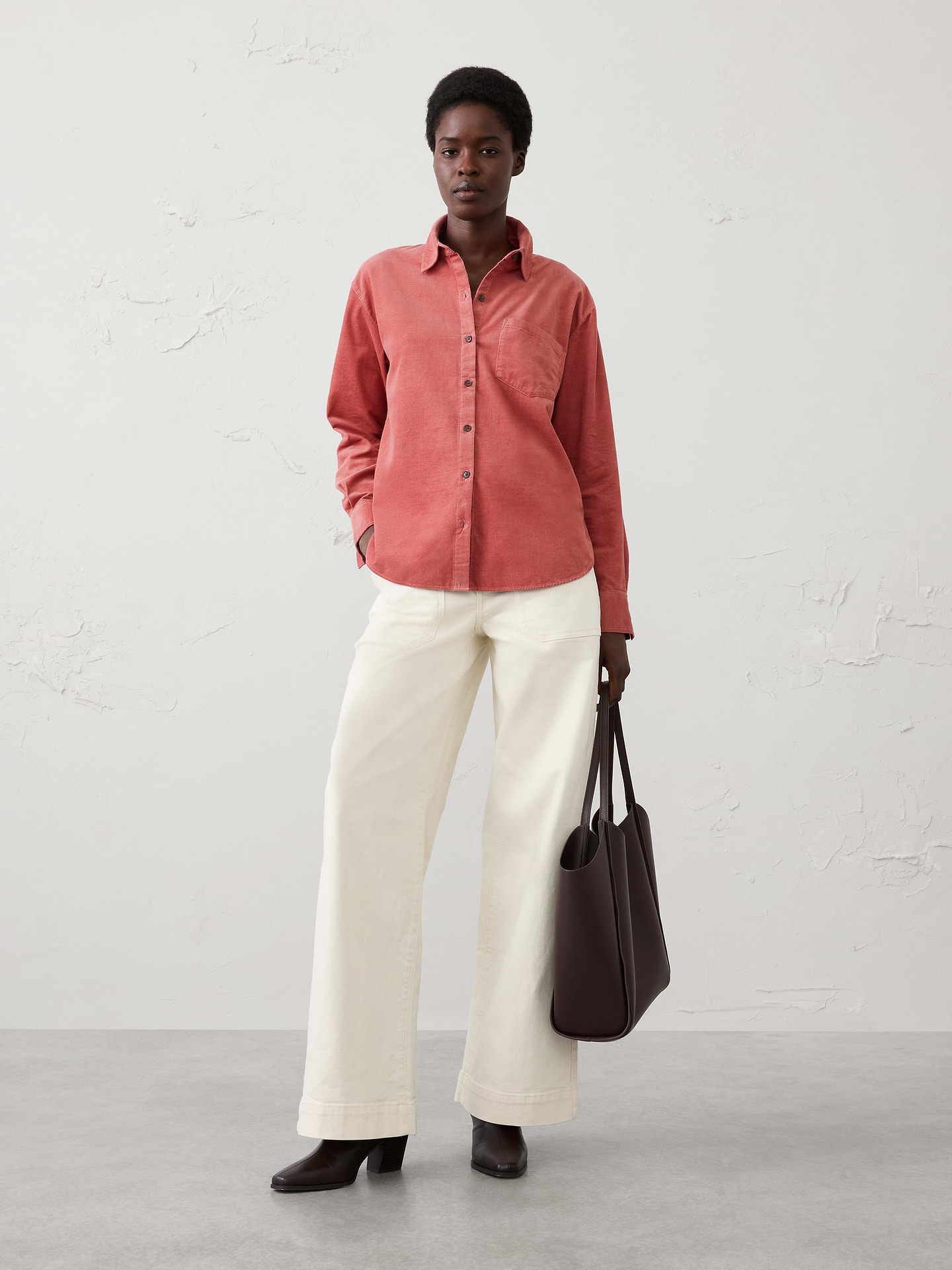 Image 1 of 4, Stand collar. Long sleeves with buttoned cuffs., Button‑front closure., Chest pocket., Back yoke with box pleat., High-low shirttail hem., 1185917, Made exclusively for Banana Republic Factory., Product #1185917