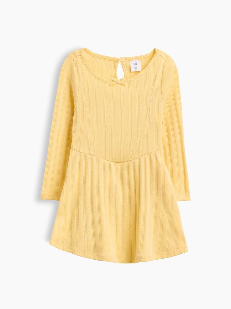 Image 1 of 3, Soft, pointelle rib knit dress., Round neck with ribbon bow at front., Loop button keyhole closure at back., Long sleeves., Bodice and waist seams., Product #1183537