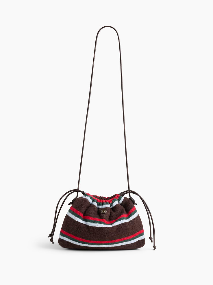 Image 1 of 6, Supersoft pouchette bag., Worn hand-held, crossbody or over-the-shoulder., Vegan leather shoulder strap., Drawcord closure at top., Product #1186131
