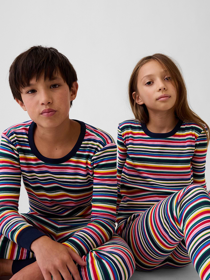 Image 1 of 6, Our comfiest PJs—now softer than ever. Cozy brushed cotton on the inside. All their favorite prints & colors on the outside., Soft cotton jersey pajama top and pants PJ set with a cozy brushed interior., Crewneck., Long sleeves., Elasticized waist at PJ pants., Banded cuffs., Allover print., Made with 100% organically grown cotton which is grown without the use of synthetic pesticides and fertilizers., Shop matching PJs for all., This product was made in a factory that invests in gender equity and women’s empowerment through RISE. Learn more at gapinc.com/equity ., Product #915891