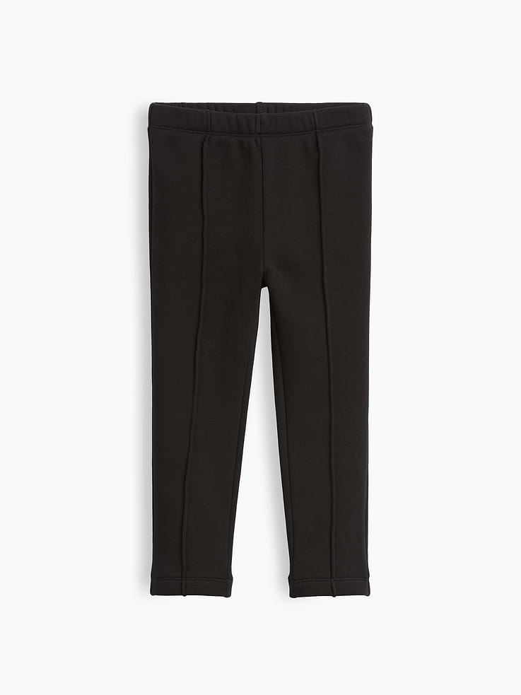 Image 1 of 4, Soft, stretch knit leggings with a cozy sherpa lining., Elasticized waist., Pintuck detailing at front., Made with 37% recycled polyester. Compared to virgin materials, using recycled materials helps reduce resource use and waste., This product was made in a factory that invests in gender equity and women’s empowerment through RISE. Learn more at gapinc.com/equity ., Product #1184974
