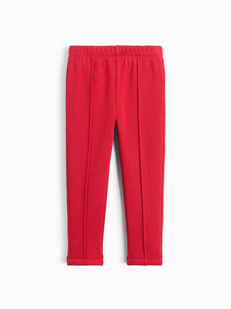 Image 1 of 4, Soft, stretch knit leggings with a cozy sherpa lining., Elasticized waist., Pintuck detailing at front., Made with 37% recycled polyester. Compared to virgin materials, using recycled materials helps reduce resource use and waste., This product was made in a factory that invests in gender equity and women’s empowerment through RISE. Learn more at gapinc.com/equity ., Product #1184974
