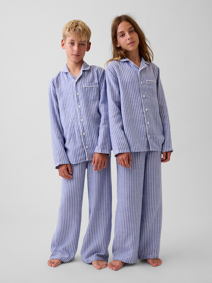 Image 1 of 3, Soft, brushed flannel pajama shirt. In a relaxed fit., Notch collar, button front., Long sleeves., Chest patch pocket., Piping detail at edges., Allover print., Made with 100% recycled polyester. Compared to virgin materials, using recycled materials helps reduce resource use and waste., Shop matching PJs for all., This product was made in a factory that invests in gender equity and women’s empowerment through RISE. Learn more at gapinc.com/equity ., Product #1180455