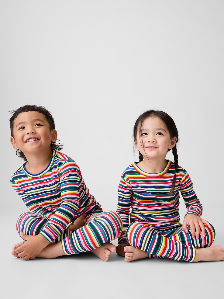 Image 1 of 3, Our comfiest PJs—now softer than ever. Cozy brushed cotton on the inside. All their favorite prints & colors on the outside., Soft organic cotton pajama top and pants set with a cozy brushed interior., Crewneck., Long sleeves., Elasticized waist at PJ pants., Banded cuffs., Allover stripes., Made with 100% organically grown cotton which is grown without the use of synthetic pesticides and fertilizers., Shop matching PJs for all., Product #815292