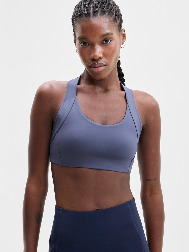 Image 1 of 4, BEST FOR CARDIO: run + train + HIIT, IMPACT: Medium-impact workouts, best for D-DD cups, FEEL: PowerMove fabric is sleek, weightless, and helps keep you cool with quick-drying properties, FAVE: Back mesh detail offers optimal breathability, Built-in pockets with removable pads for optional coverage, Product #1179322