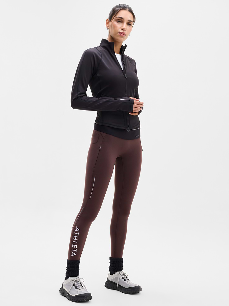 Image 1 of 6, FOR: Your toughest cold-weather training sessions, FEEL: Plush SuperSonic has a brushed interior with supportive compression, FAVE: Reflective details for workouts at dawn or dusk, Secure side zip pockets with a new earbud pocket, Continuous drawstring, Our #1 cold-weather legging is back with a new refined fit. Featuring no front seam, modernized lines, and more reflectivity., Product #1186691