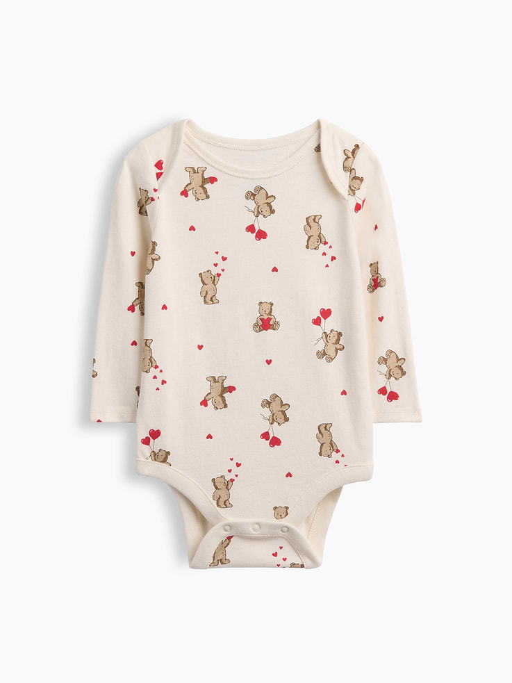 Image 1 of 3, From baby’s first outfit to all their first moments. Our favorite tiny essentials in supersoft, organically grown cotton., Soft cotton jersey bodysuit., Crewneck with lapped shoulders for easy over-the-head., Long sleeves., Allover print., Snaps at inseam for easy dressing and diapering., Made with 100% organically grown cotton which is grown without the use of synthetic pesticides and fertilizers., Explore our babyGap Guide ., This product was made in a factory that invests in gender equity and women’s empowerment through RISE. Learn more at gapinc.com/equity ., Product #1186043