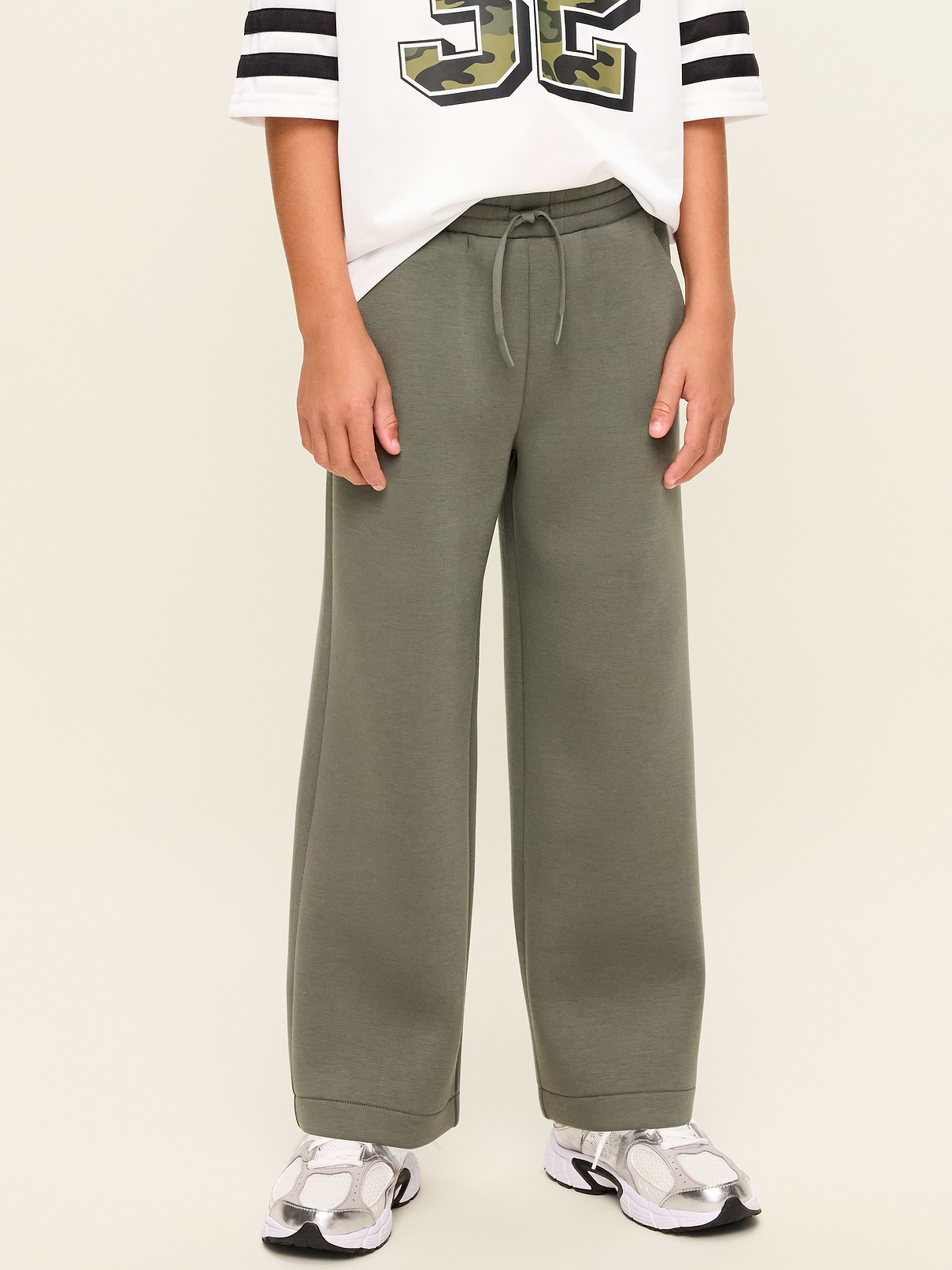 Image 1 of 3, Keep ’em moving in Old Navy Sport's Bounce Fleece: Our signature smooth spacer fabric that keeps its shape., elasticized waistband, functional drawstring, diagonal on-seam pockets, 4-way stretch, Product #907678