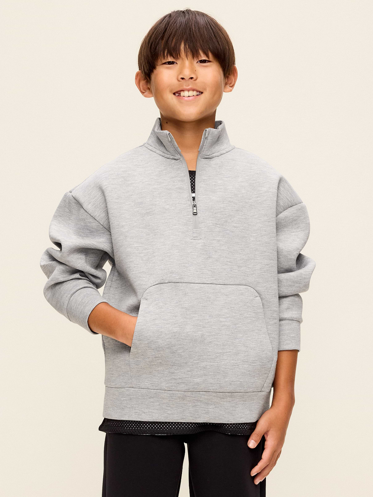 Image 1 of 2, Keep ’em moving in Old Navy Sport's Bounce Fleece: Our signature smooth spacer fabric that keeps its shape., mock neck, quarter zip, long sleeves, drop shoulders, kangaroo pocket, 4-way stretch, Product #907687