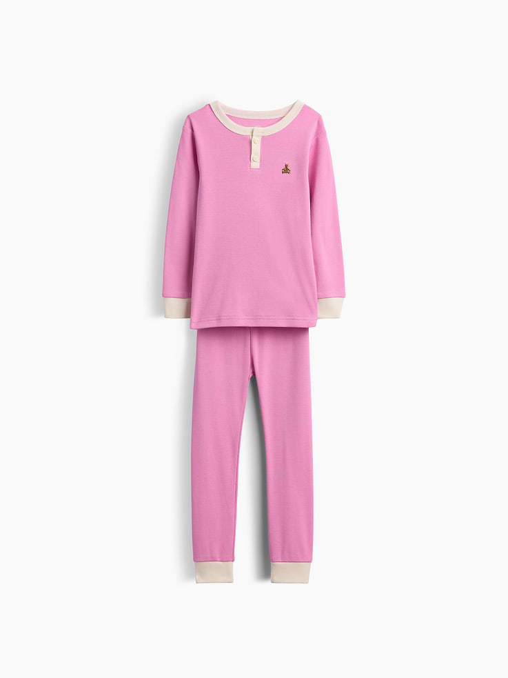Image 1 of 2, Our comfiest PJs—now softer than ever. Cozy brushed cotton on the inside. All their favorite prints & colors on the outside., Soft cotton Henley pajama top and pants PJ set with a cozy brushed interior., Crewneck with front button placket., Long sleeves., Elasticized waist at PJ pants., Banded cuffs., Colorblock design., Made with 100% organically grown cotton which is grown without the use of synthetic pesticides and fertilizers., This product was made in a factory that invests in gender equity and women’s empowerment through RISE. Learn more at gapinc.com/equity ., Product #913272