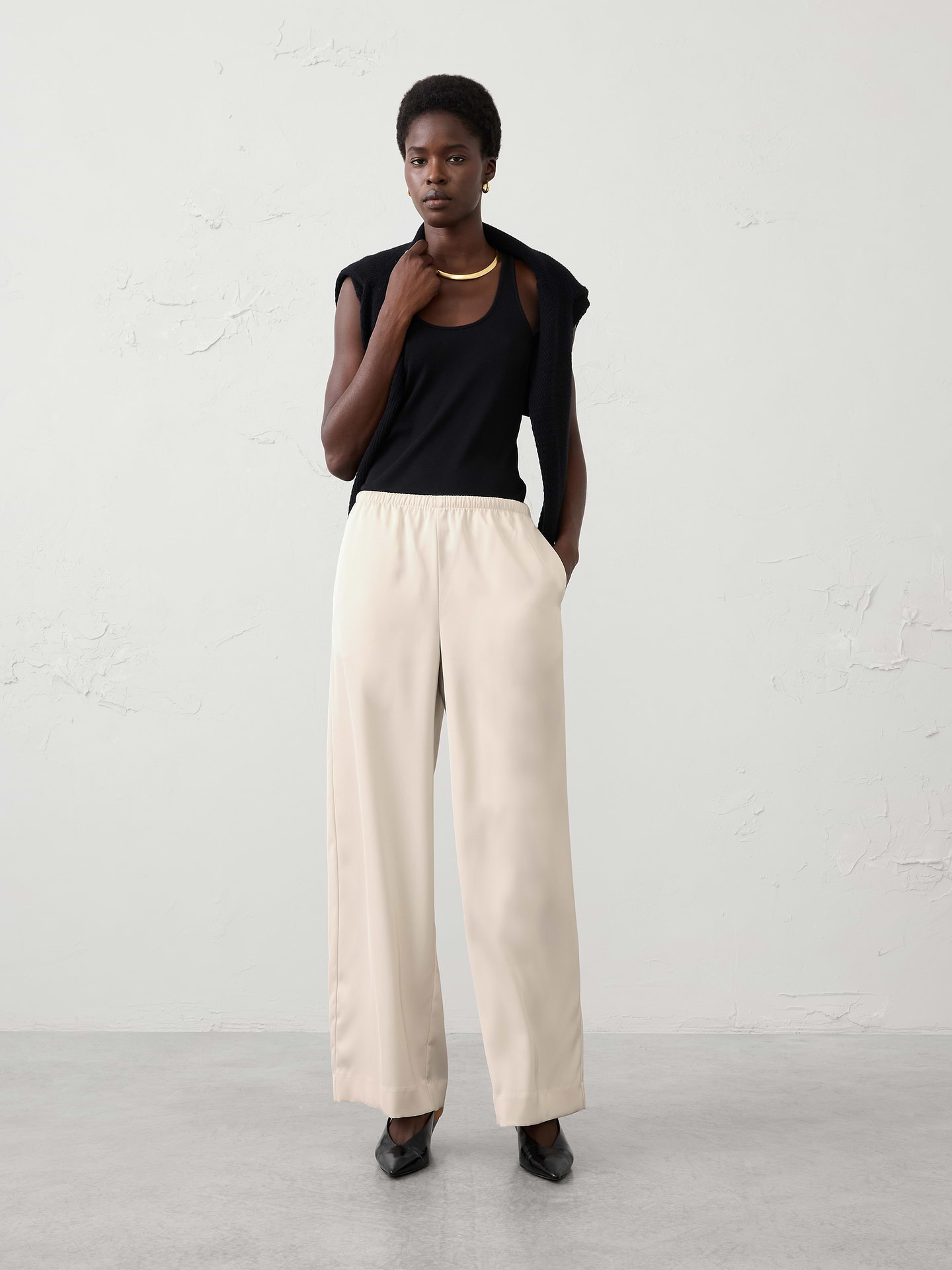 Image 1 of 3, Effortlessly elegant and endlessly versatile, our satin pant is designed to take you from casual gatherings to special occasions with ease. Crafted from lightweight satin fabric with a fluid drape and subtle sheen. The pull-on design offers effortless wear, while the clean, streamlined look makes it easy to dress up with heels for a party or pair with a cozy sweater and flats for a more relaxed approach., Pull-on pant. Elasticized waistband., Relaxed wide-leg silhouette., Made exclusively for Banana Republic Factory., Product #1182237