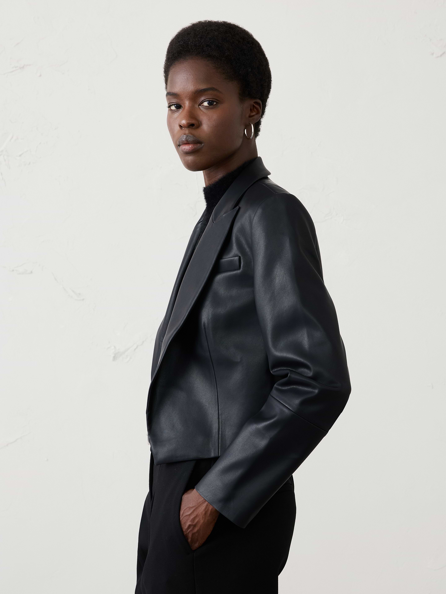 Image 1 of 4, VEGAN LEATHER: Soft and smooth, this faux leather looks and feels luxurious., Peak lapel. Long sleeves., Open front., Vertical welt front pockets., Chest pocket., Fully lined., Made exclusively for Banana Republic Factory., Product #1182556