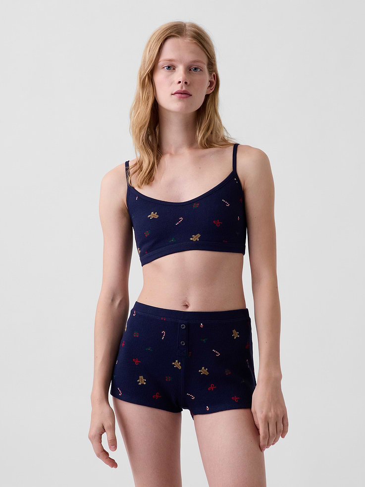 Image 1 of 3, Soft, stretch waffle knit bralette., Scoop v-neck., Adjustable spaghetti straps., Elasticized band., Allover print., This product was made in a factory that invests in gender equity and women’s empowerment through RISE. Learn more at gapinc.com/equity ., Product #1186872