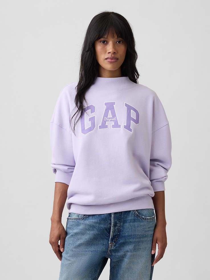 Image 1 of 5, This style is made with 23% recycled polyester. Compared to virgin materials, using recycled materials helps to reduce resource use and waste., Soft, comfy fleece., Dropped shoulder, long sleeves with banded cuffs., Mockneck., Gap logo at front., Banded hem., Product #1174684