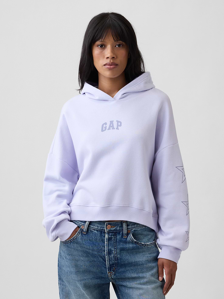 Image 1 of 5, This product is made with/contains at least 23% recycled polyester. Compared to virgin materials, using recycled materials helps reduce resource use and waste., Soft, comfy fleece., Dropped shoulder, graphics at long balloon sleeves with banded cuffs., Hood., Mini Gap logo at front., Banded hem., This product was made in a factory that invests in gender equity and women’s empowerment through RISE. Learn more at, Product #1191904