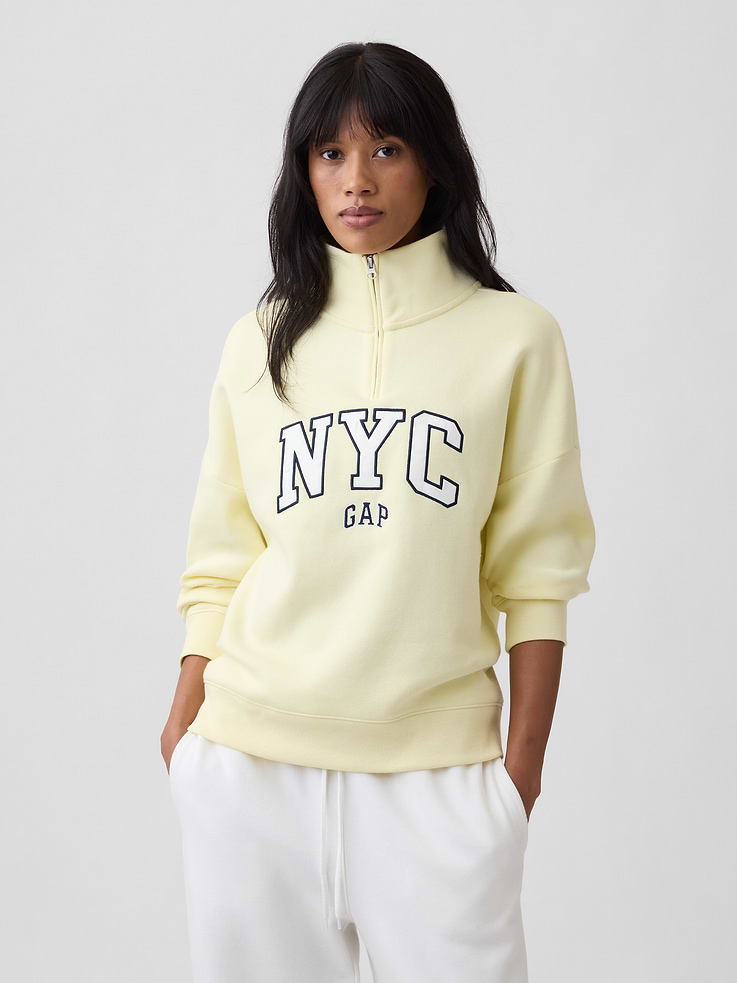 Image 1 of 5, This product is made with/contains 23% recycled polyester. Compared to virgin materials, using recycled materials helps reduce resource use and waste., Soft, comfy fleece., Dropped shoulder, long sleeves with banded cuffs., Stand collar, quarter-zip front., Gap NYC logo at front., Banded hem., Product #1196067