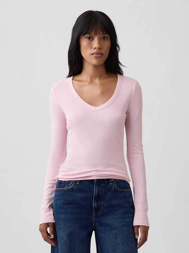 Image 1 of 5, Soft ribbed knit., Long sleeves., V-neck., Select styles have allover print or stripes., This product was made in a factory that invests in gender equity and women’s empowerment through RISE. Learn more at, Product #1179572