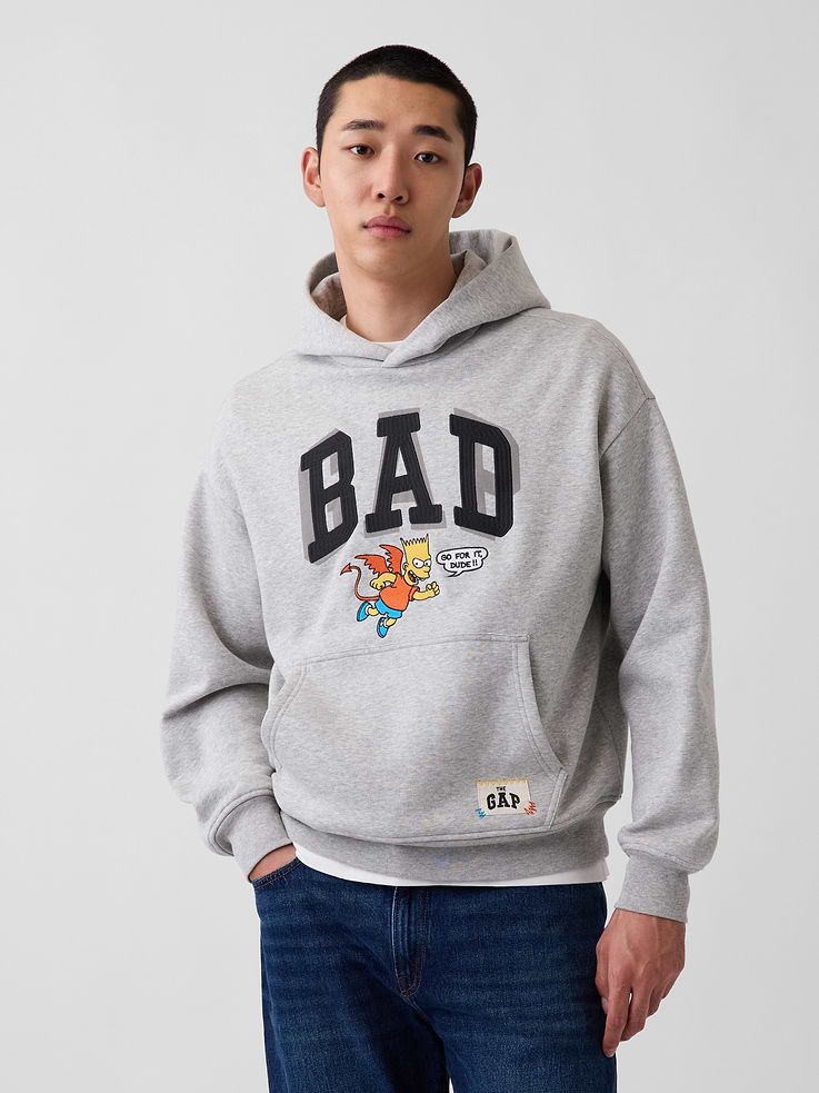 Image 1 of 9, Soft cotton-blend fleece hoodie. In an oversized fit., Hooded neckline., Long sleeves with dropped shoulders., Kanga pocket at front., Banded hem and cuffs., The Simpsons graphics., Made with 23% recycled polyester. Compared to virgin materials, using recycled materials helps reduce resource use and waste., Product #907426